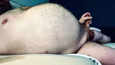 FAT DADDY STROKING HIS THICK UNCUT COCK ON THE COUCH