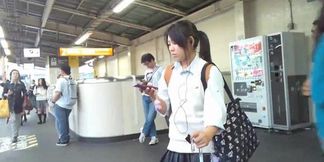 Asian teen in school uniform caught in upskirt peep show
