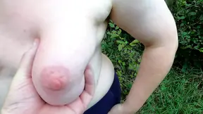 Clamps on nipples and whipping her tits in the woods