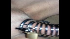 With the chastity cage