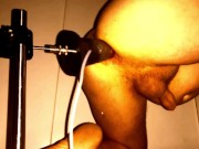 Two dildos on fuckmachine, ejaculating dildo