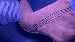 Up close to my foot revving in brown knee high boots