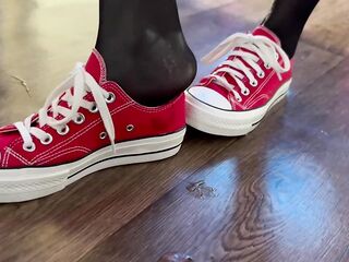 hotty in stockings sucks a thick ramrod and spits on her feet. juicy nylon feet
