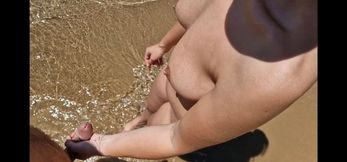 Dickflash on a nudist beach I approach a stranger and she is masturbating, touching my dick