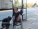 Naughty brunette in a wheelchair is spreading her legs wide open, to show her pussy