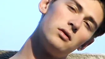 Twink Shane Allen smokes and strokes his big cock outdoors