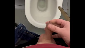 My dick cums in a public toilet close up