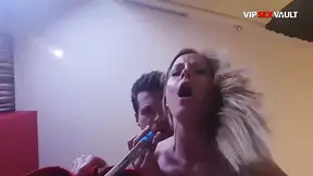 Slim blonde chick gives a two-handed handjob and licks his balls till he erupts