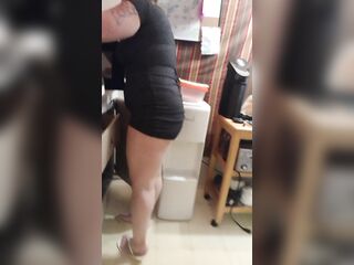 Secretary Boss gets off of work and does her duties around the abode (bending over in petticoat)