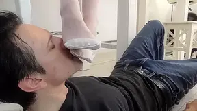 Princess Kirstin let her white stocking feet lick and kiss by her slave Bobby. by Foot Chicks