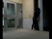 barefoot frogman cums inside a condom in front of hotel doors