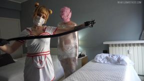 Whipping The Mummy - Mummification - whip - plastic wrap - latex gloves - nurse fetish - sub training - bdsm - masked slave - mask