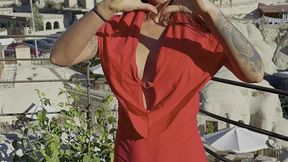 Russian bombshell Monika Fox shows off big boobs and nipple piercings in red suit