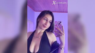 Latina in the mirror wearing lingerie