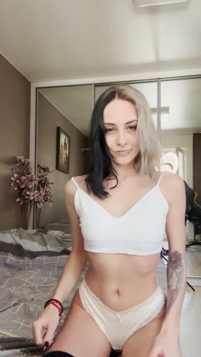 Goth pierced teen shows off natural tits