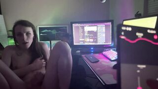 Gamer chick plays Overwatch while beau uses her magic wand.