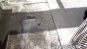 Hairy redhead Asian babe plays with her pussy and pees outside