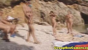 Beach gangbang with horny amateurs in doggy style