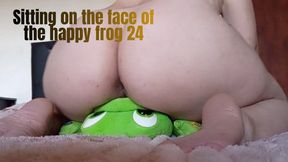 Sitting on the face of the happy frog 24