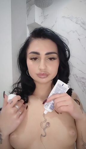 Nude woman holding toothpaste