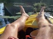 Hairy daddy long legs pumps his tight uncut cock in a kayak
