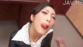 Japanese beauty has fun with two cocks as she sucks