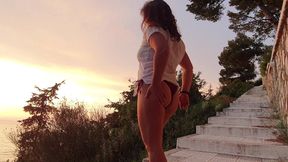 girl is pissing on hill during sunset!