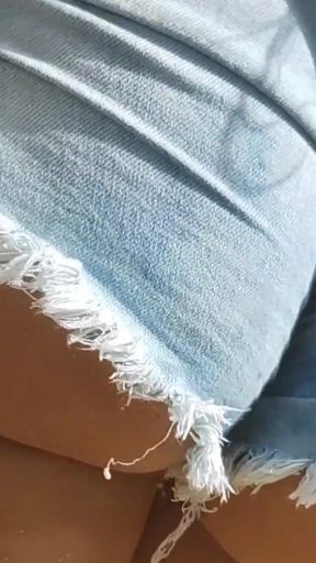 Hot girl showing off in shorts on the street   Clip 1