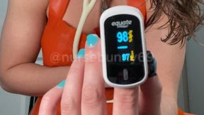 Pulse Oximeter and White Stethoscope Stimulation Testing with Vibrator in Orange Latex Apron 720p