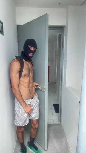 A guy with a big, flaccid penis showing off on the shopping mall stairs.