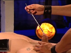 Bound stud endures melted candle wax and rough anal sex in an all-male gangbang