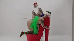 Tattooed Santa punishes busty elf with a caning