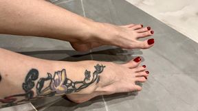 Spit on bare feet with long toes