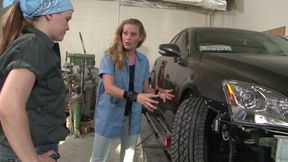 Ariel Stonem &amp; Daisy Layne, an outdoor lesbian scene in front of the car mechanic store