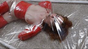 Red stretch film bondage in a vacuum bed