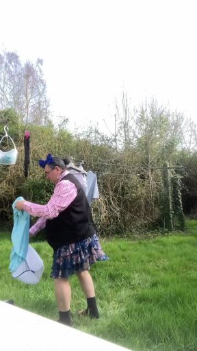 In outfit shirt tie and skirt to hang laundry outside part1