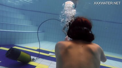 Adeline being filmed by a girl in the pool