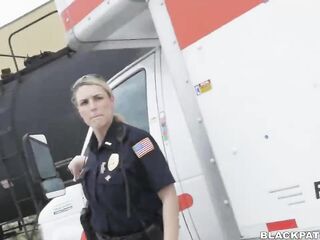 Aroused police ladies are taking turns sucking a ebony stud's dong, instead of doing their job