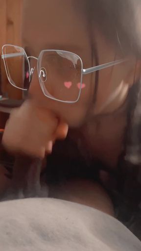 Person in glasses looking at camera