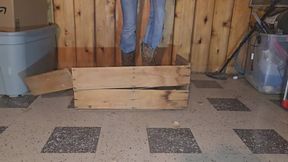 Chrissy crushing wood crate in cowgirl boots