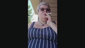 POV, wordless, casual outdoors smoking on a hot summer morning selfie Video Session, by The Mature Lady L, FemDom next door, mature smoker, short hair. Remastered, re-release Video.