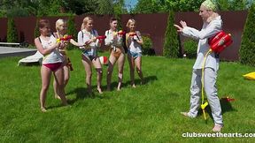 One guy and several nude teens having fun with water pistols before reverse gangbang