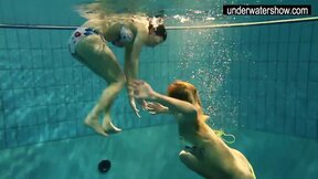 Two hot amateurs showing their bodies off under water