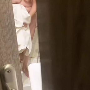 Stepbrother spied on his stepsister in the hotel bathroom and fucked her