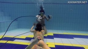 Adeline being filmed by a girl in the pool