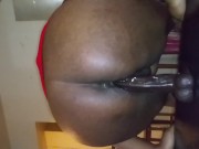 Ebony with juicy pussy riding dildo on table