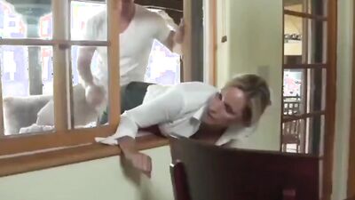 MILF is stuck in the window while two guys are fucking her