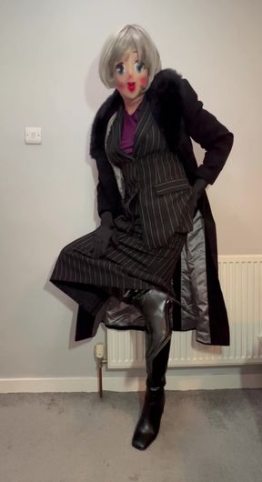 Crossdressing sissy dressed in her new skirt suit and long coat