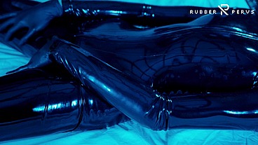 Tied up rubber girl in catsuit fucking herself