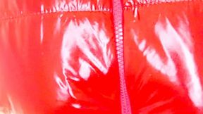 Alla shows off leather leggings and a red shiny down jacket
